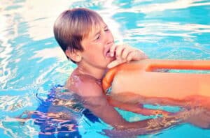 child Swimmer Coughing in Water 694944066 770x533 1 650x428