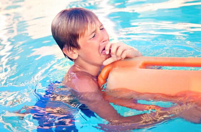 child Swimmer Coughing in Water 694944066 770x533 1