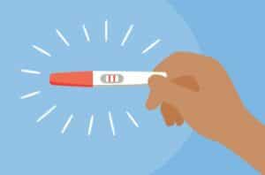 hand holding positive pregnancy test 1289105021 770x533 1 650x428