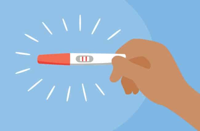 hand holding positive pregnancy test 1289105021 770x533 1