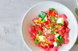 watermelon tomato corn cucumber almond salad 577960298 770x533 1 650x428