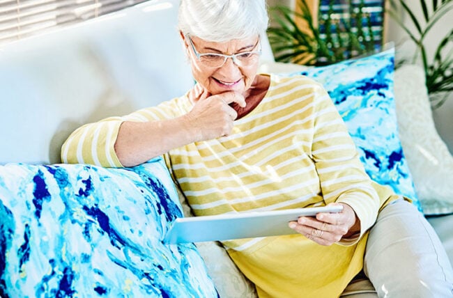 person reading tablet living room 1203945692 770x533 1