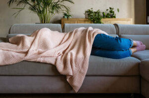 person Sleeping Under Blanket Migraine 1284882341 770x533 1 650x428