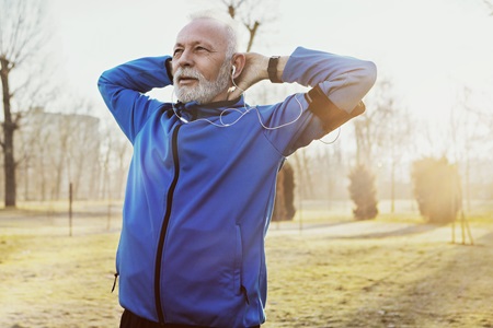 activeseniorstretchingoutside