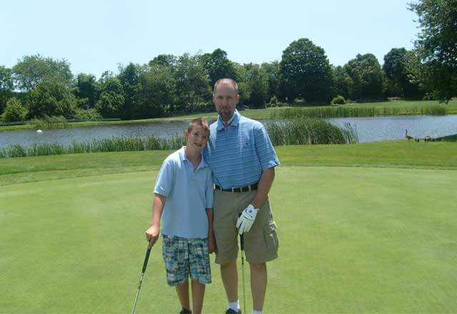 steve with son golfing